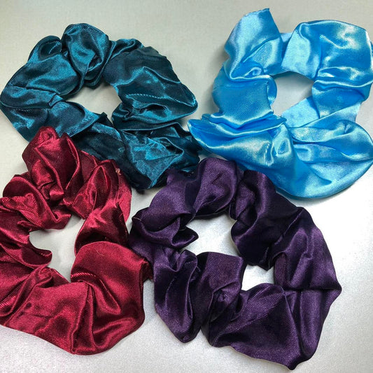 Four colourful hair scrunchies