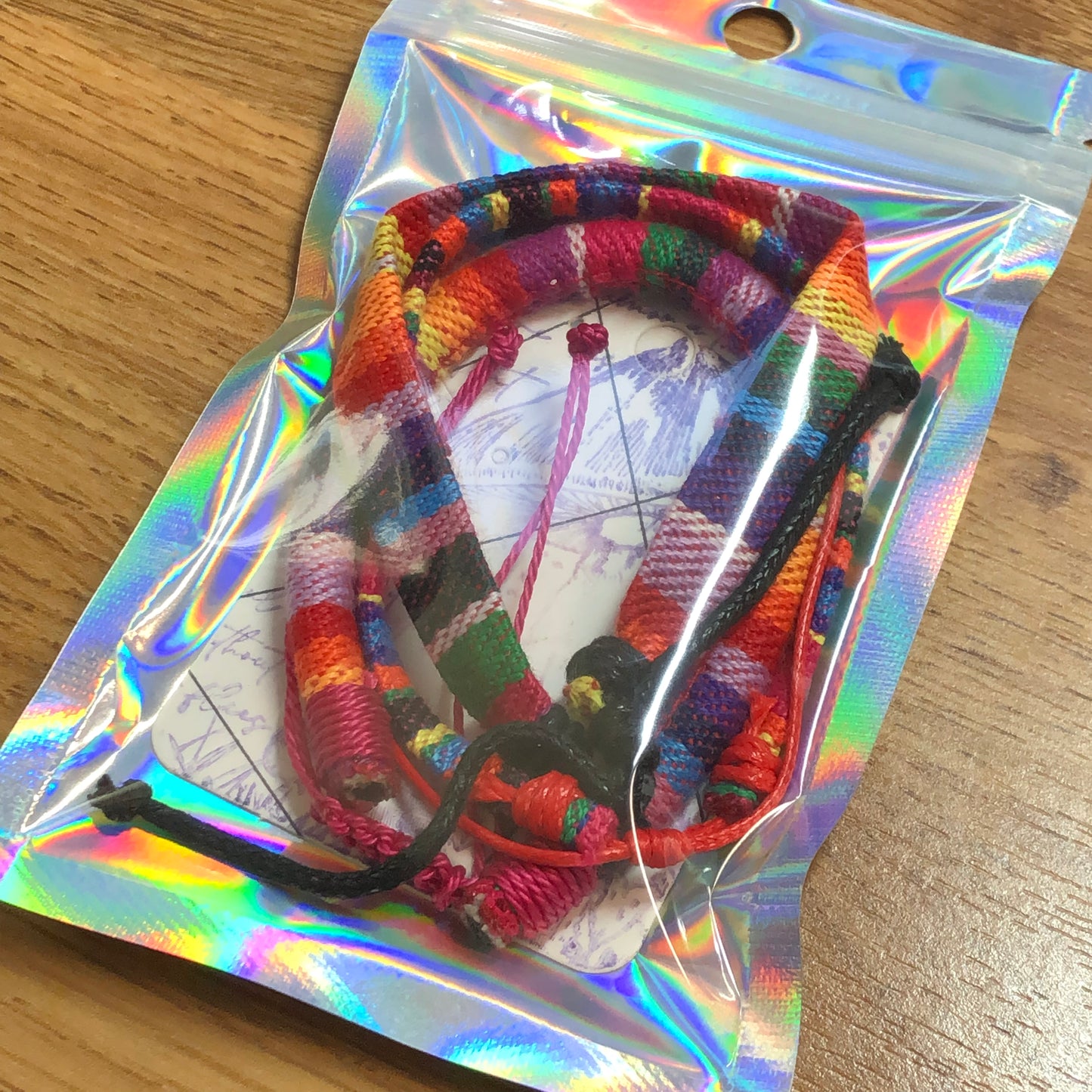 Three rainbow handmade string cord braided woven stackable bracelets