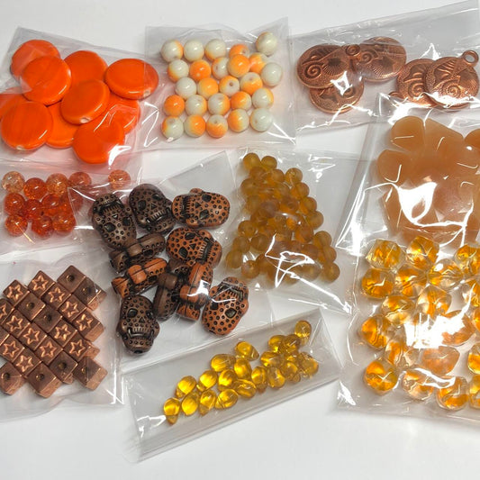 Ten orange packs jewellery making beads