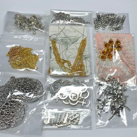 Ten mixed packs of jewellery findings and charms