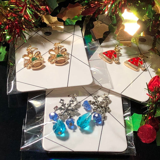 Three pairs Christmas earrings bells, hats and snowflakes