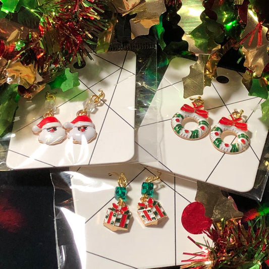 Three pairs Christmas earrings Santas, wreaths and gifts