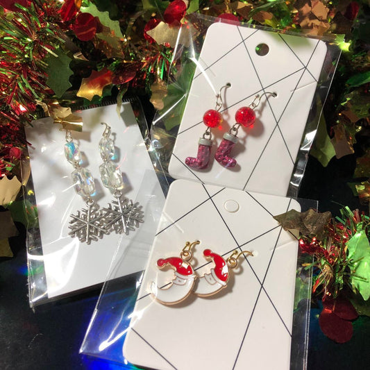 Three pairs Christmas earrings boots, Santa and snowflakes