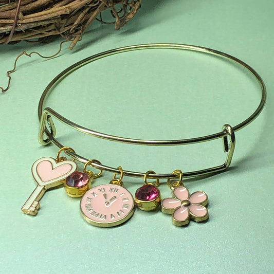 Pink key, clock and flower expandable bangle