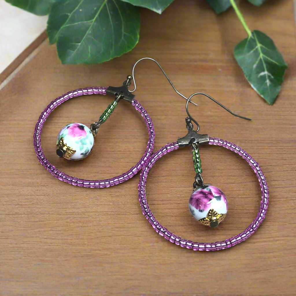 Lucinda - Pink glass hoop earrings with floral porcelain beads