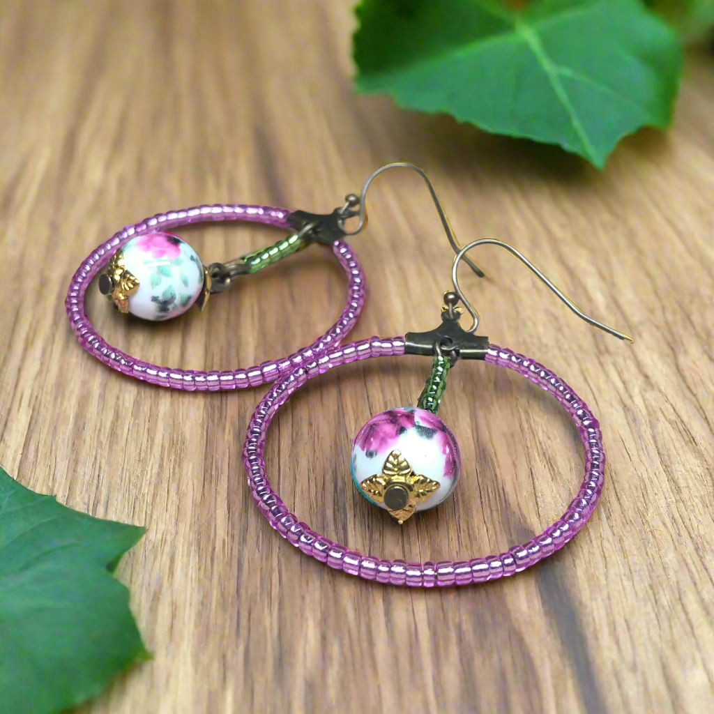 Lucinda - Pink glass hoop earrings with floral porcelain beads