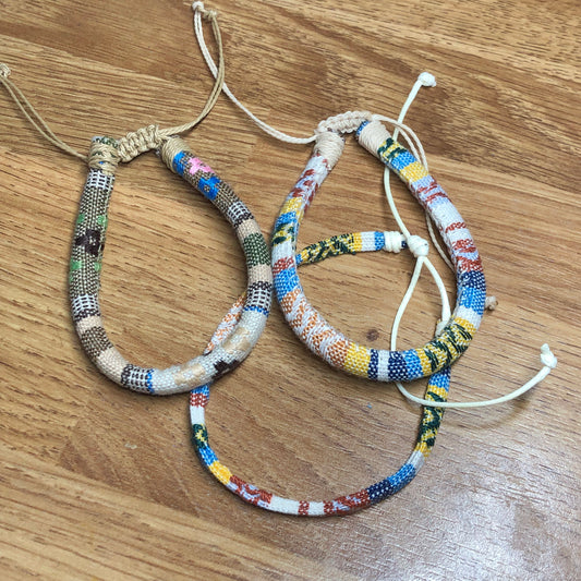 Three light handmade Bohemian cord braided woven stackable bracelets