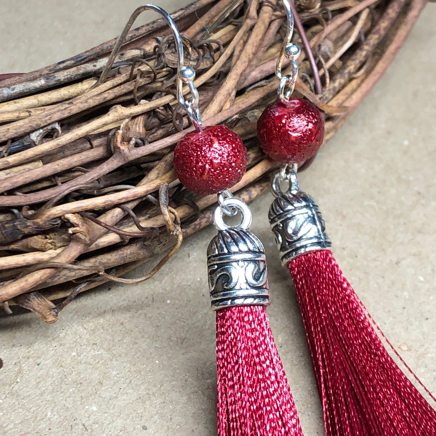 Raspberry tassel earrings with dewy beads