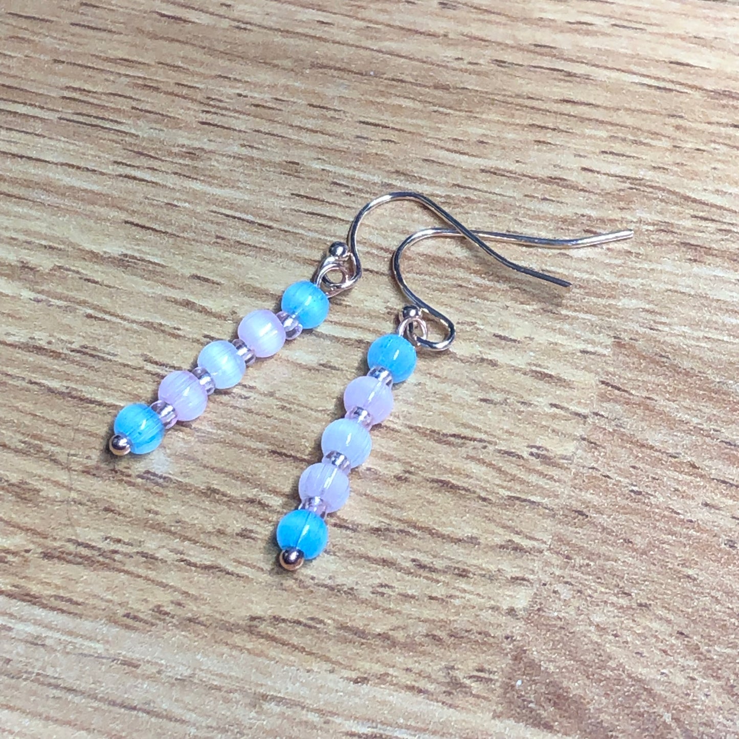 Trans Perfect - pastel pink cats eye glass earrings