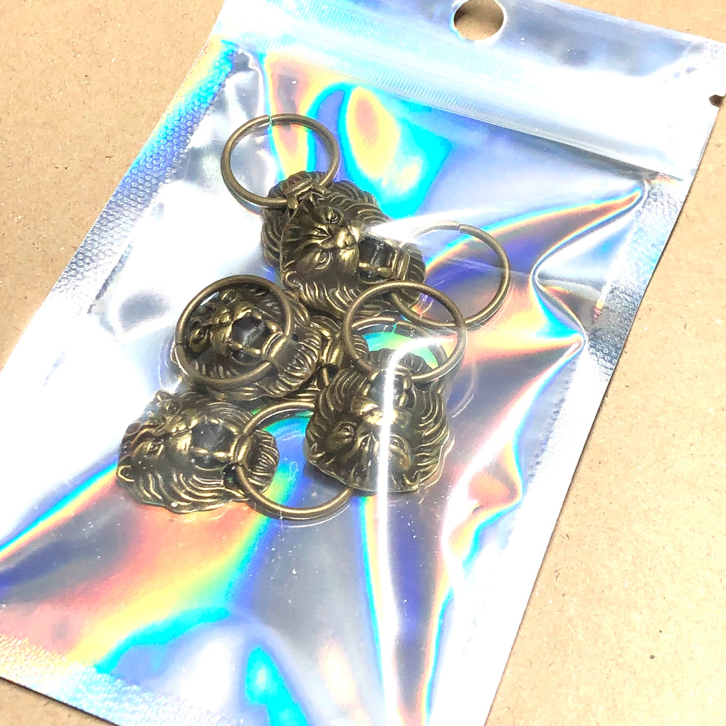 Six bronze doorknocker charms