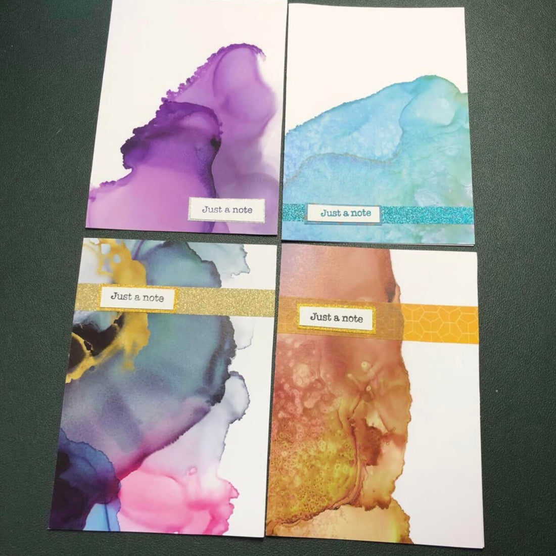 Four unique watercolour design handmade cards