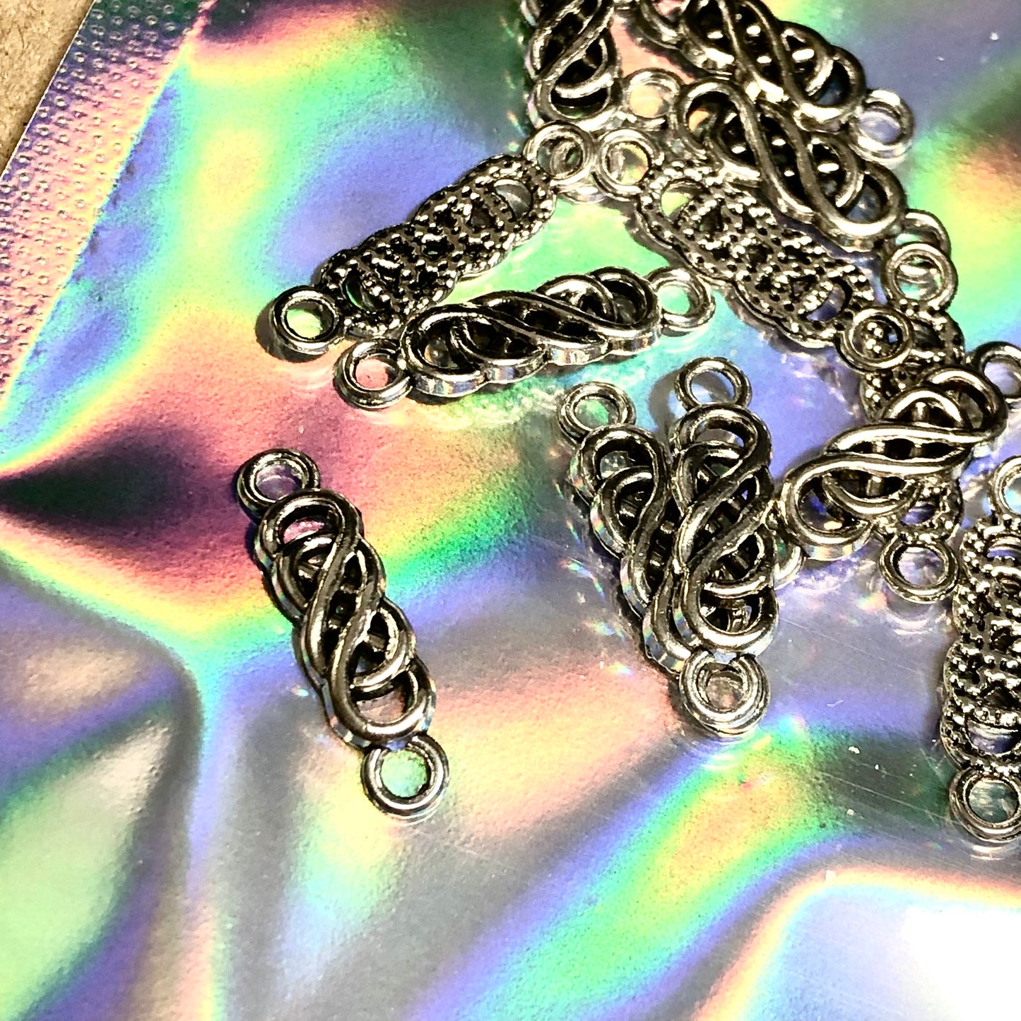 Twelve Celtic knot braid charms