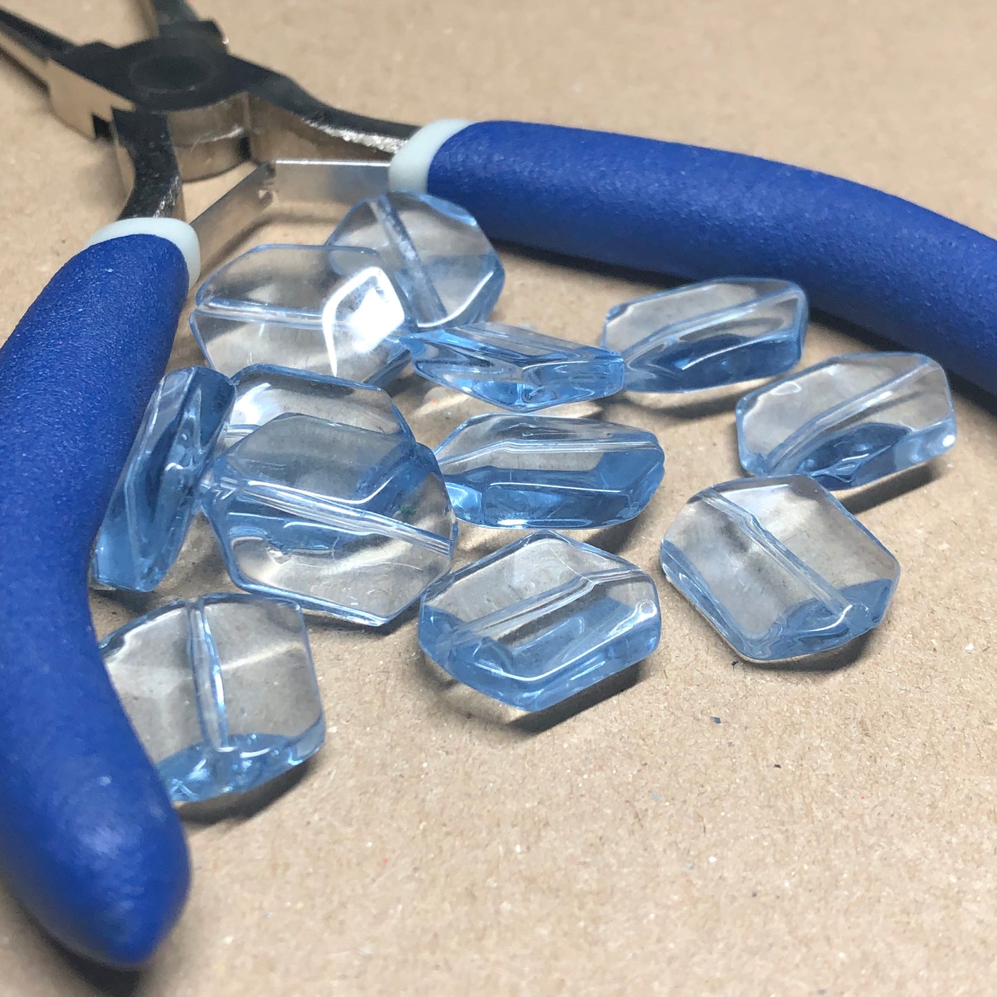 Light blue faceted hexagonal glass beads