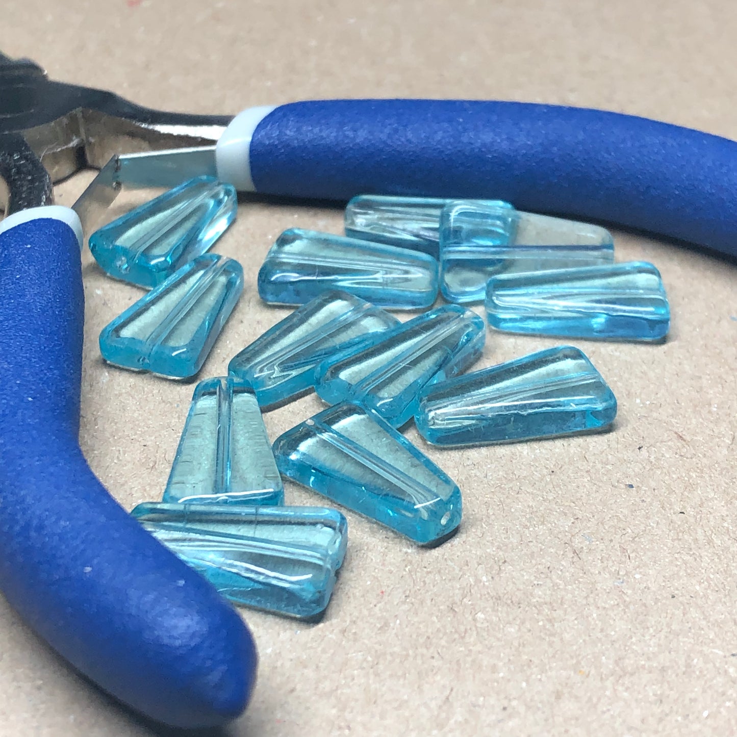 Turquoise blue rhomboid glass beads