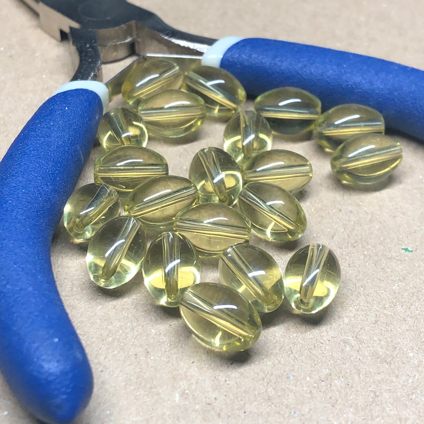 Light yellow oval glass beads