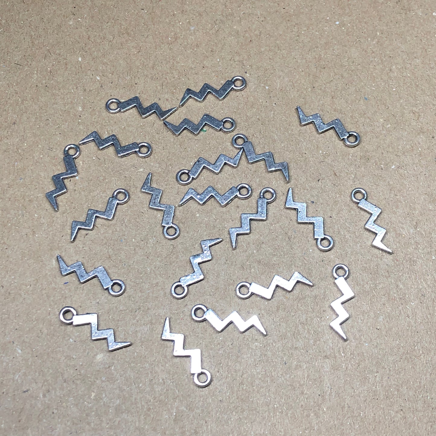 Twenty lightning bolt charms