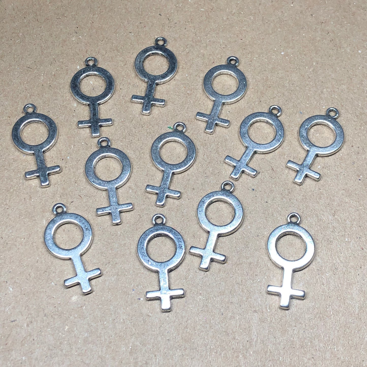 Twelve female symbol charms