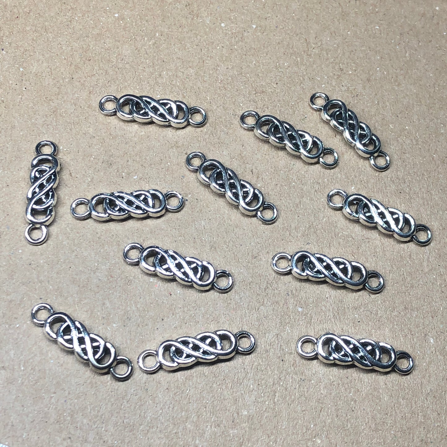 Twelve Celtic knot braid charms