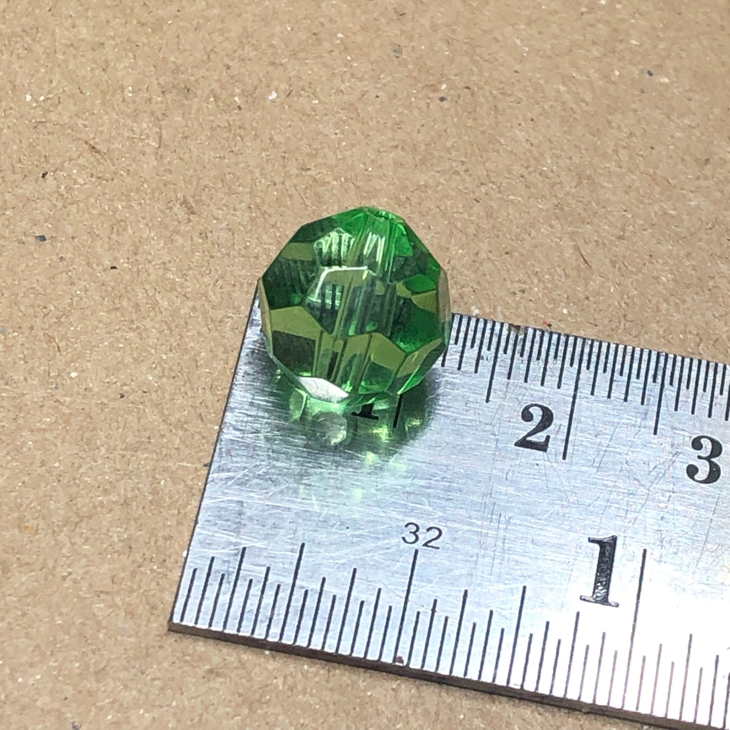 Green round faceted glass beads