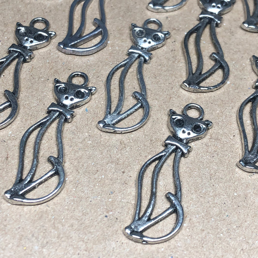 Twelve tall cat outline charms