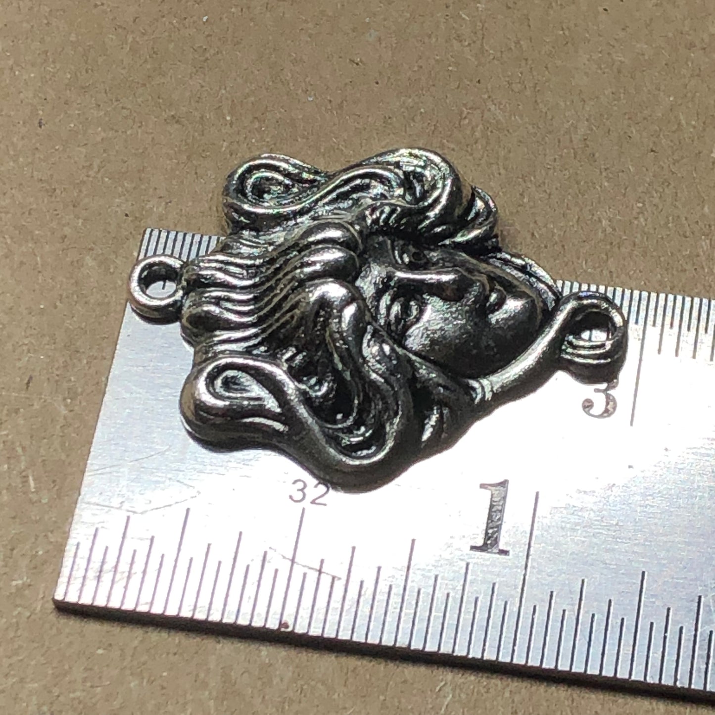 Twelve goddess head connector charms