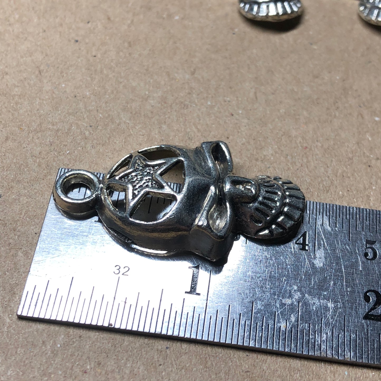 Six large skull charms