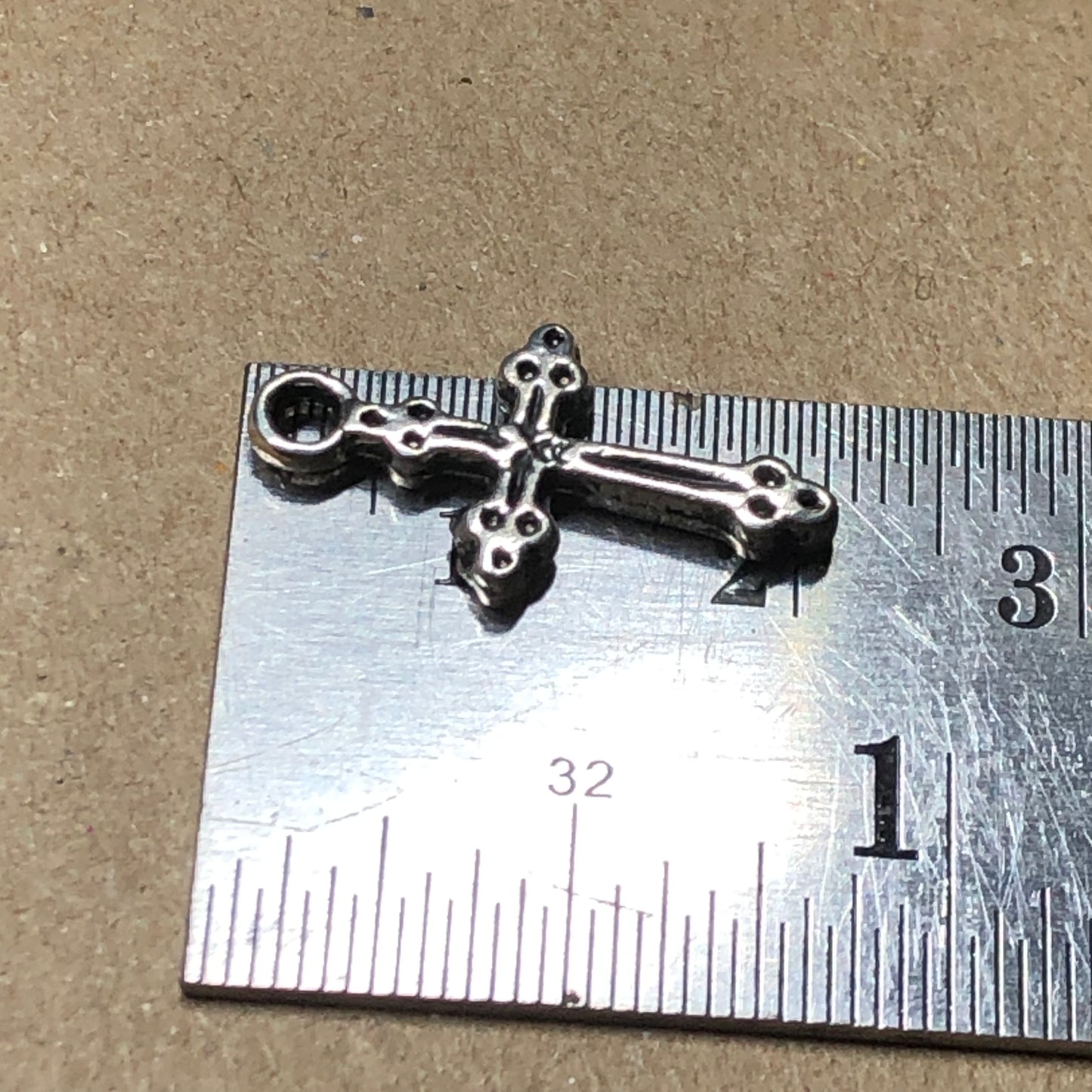 Twelve crucifix cross charms