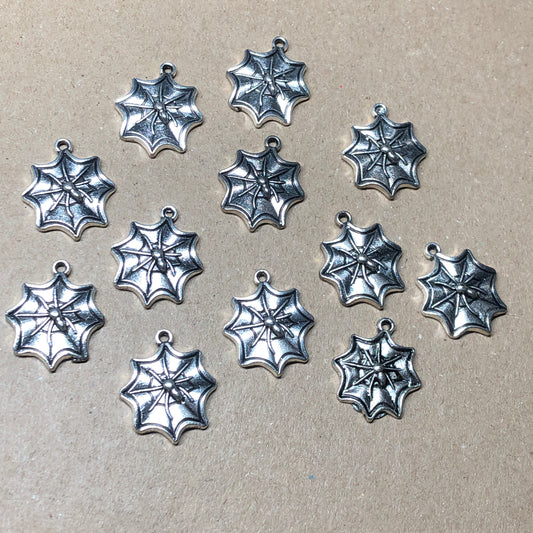 Twelve spiderweb charms