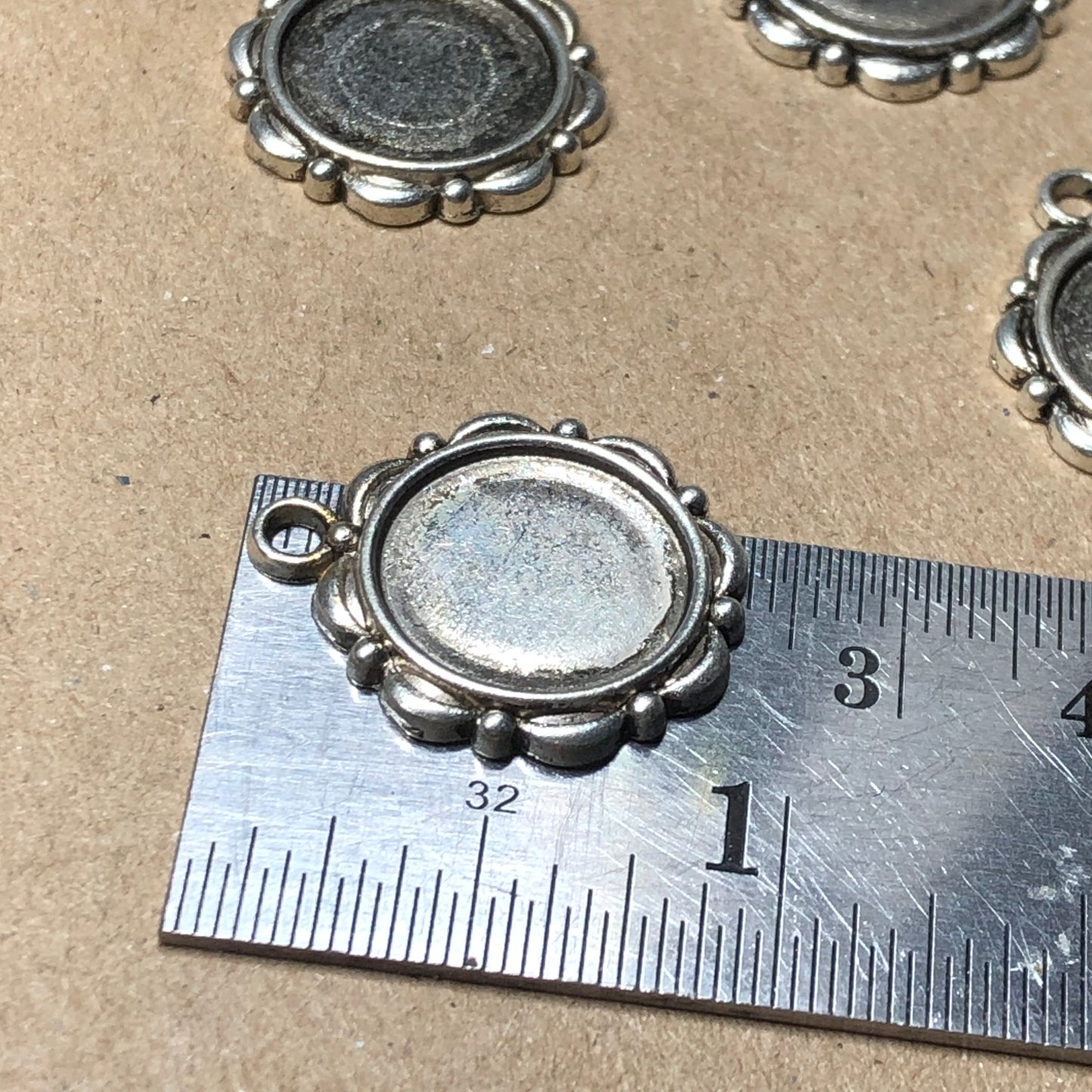 Ten bezel pendant charms