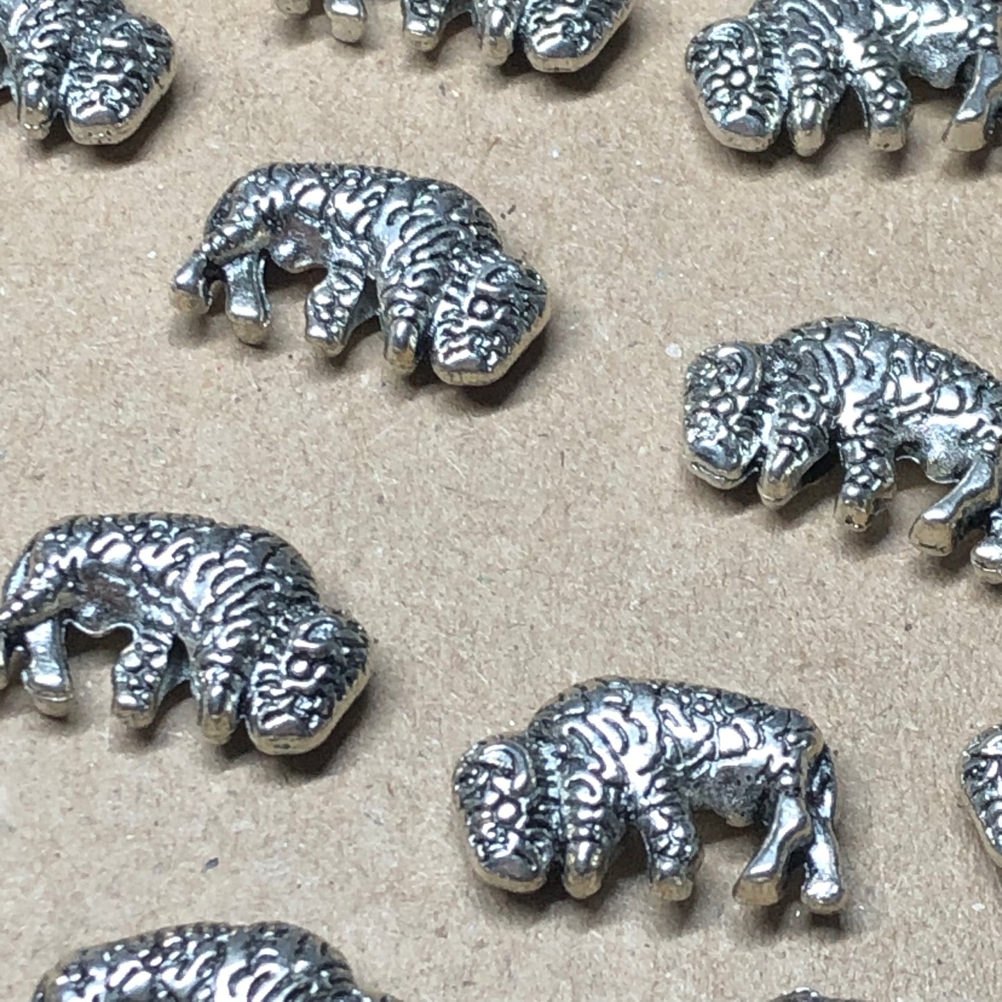 Twelve bison animal charms