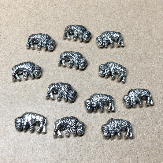 Twelve bison animal charms