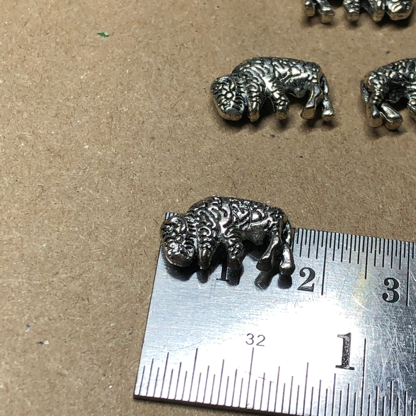 Twelve bison animal charms