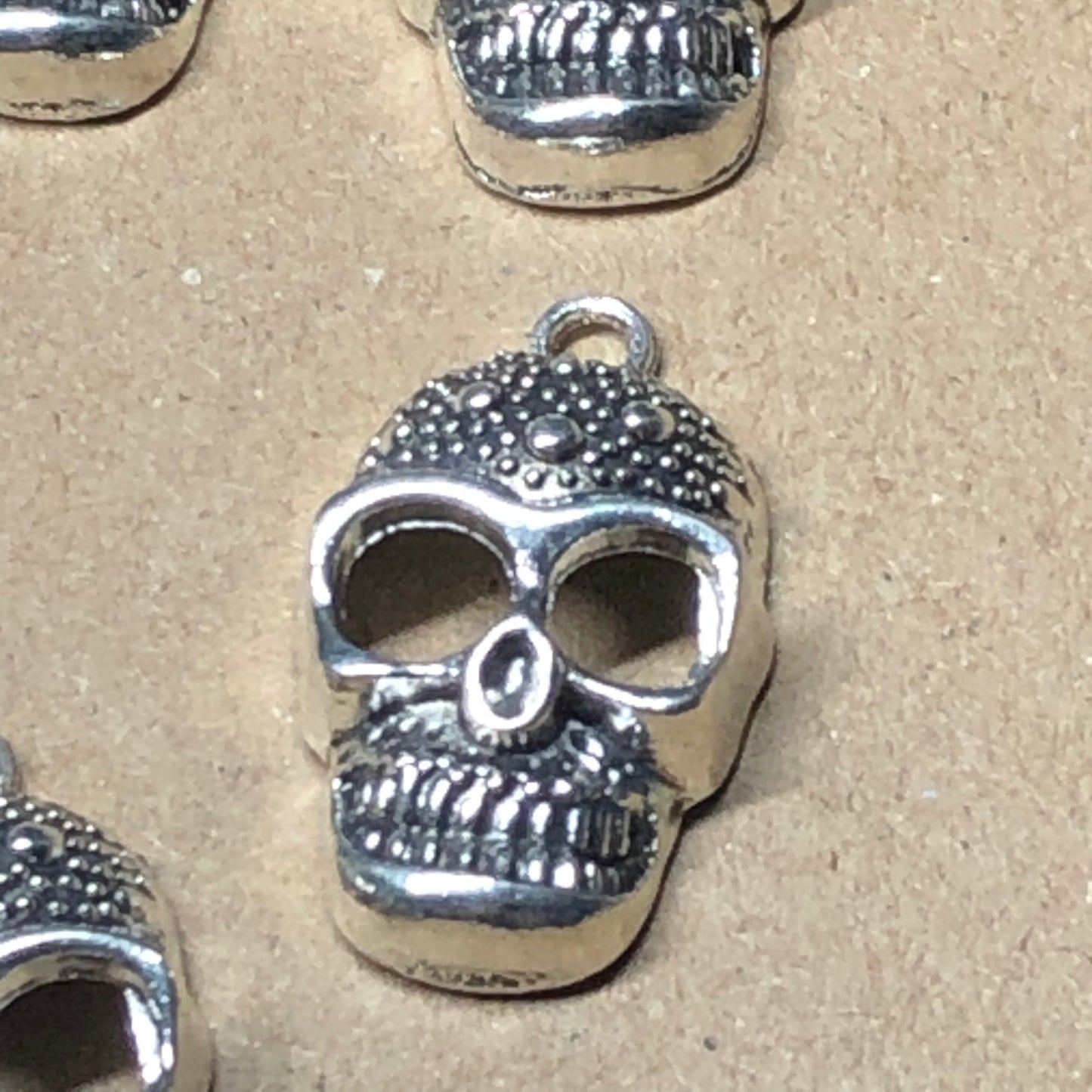 Six spotted skull charms