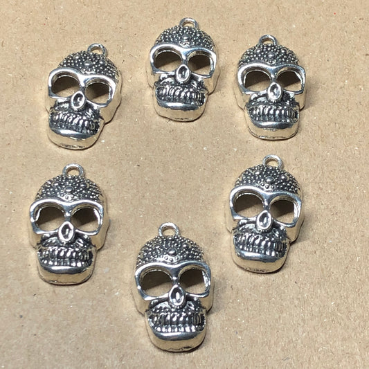 Six spotted skull charms