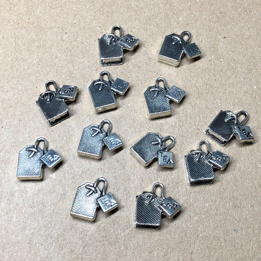 Twelve teabag charms