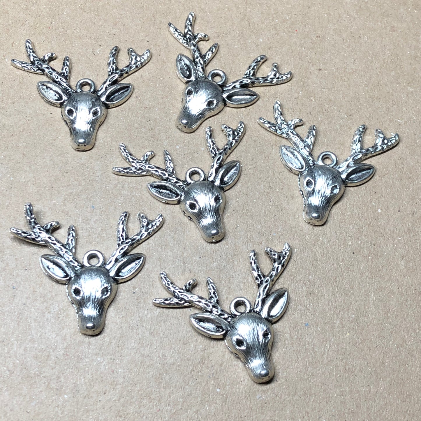 Six large reindeer stag head charms