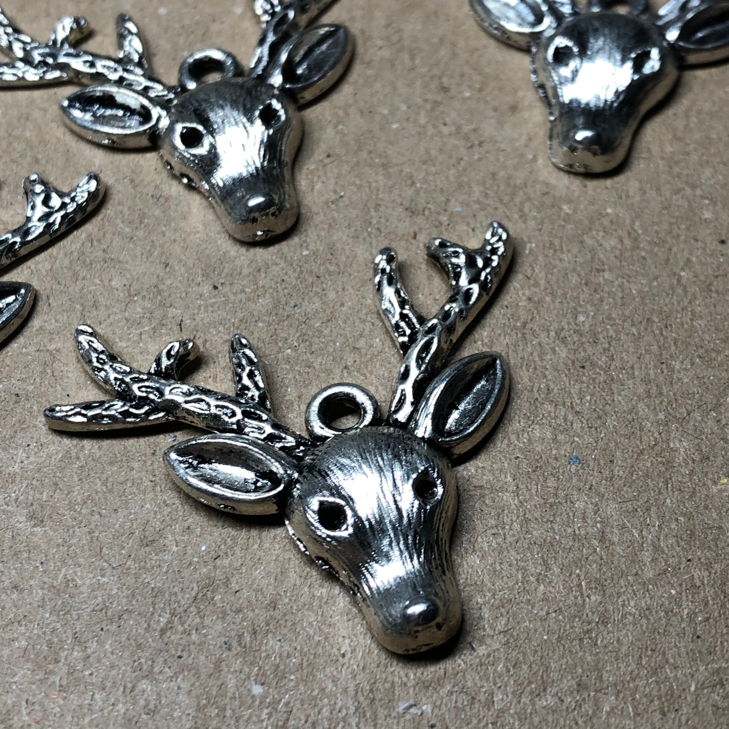 Six large reindeer stag head charms