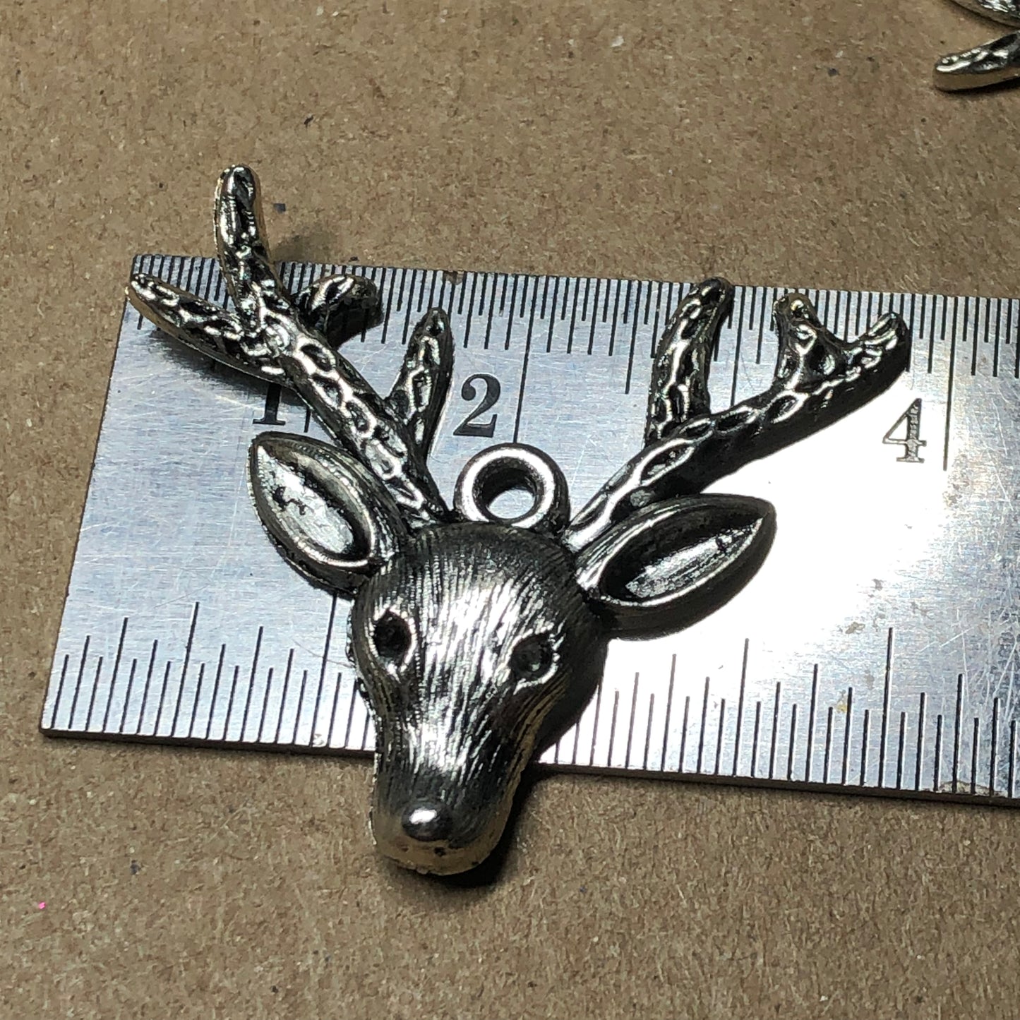 Six large reindeer stag head charms