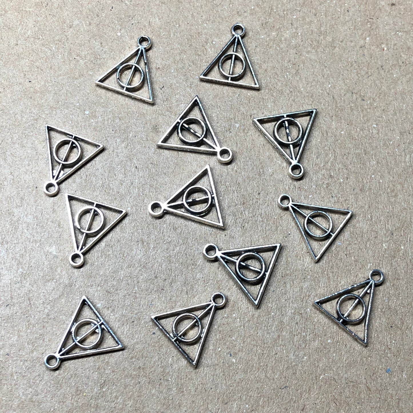 Twelve wizard symbol charms