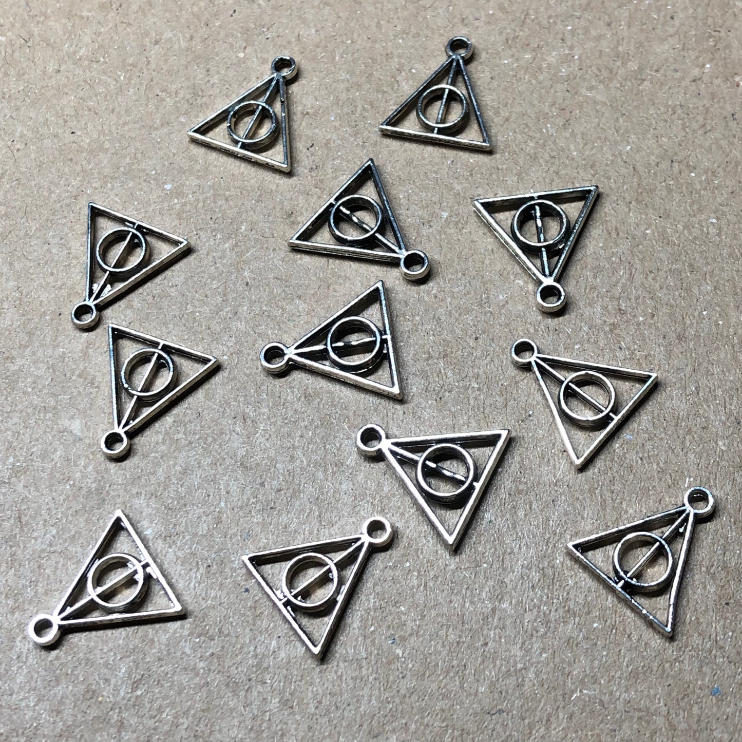 Twelve wizard symbol charms