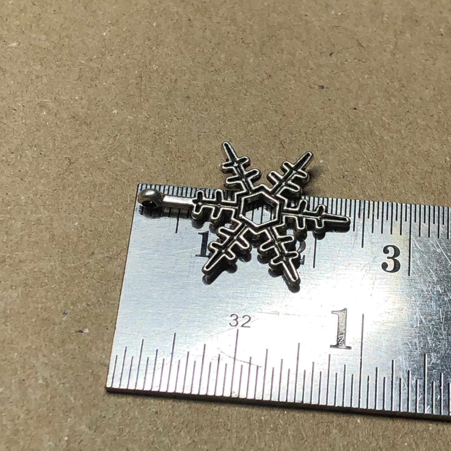 Twelve spikey snowflake charms