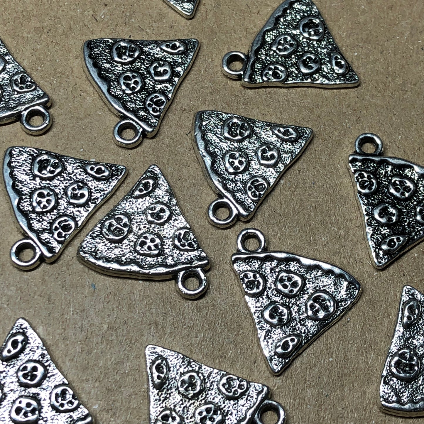 Twelve pizza slice charms