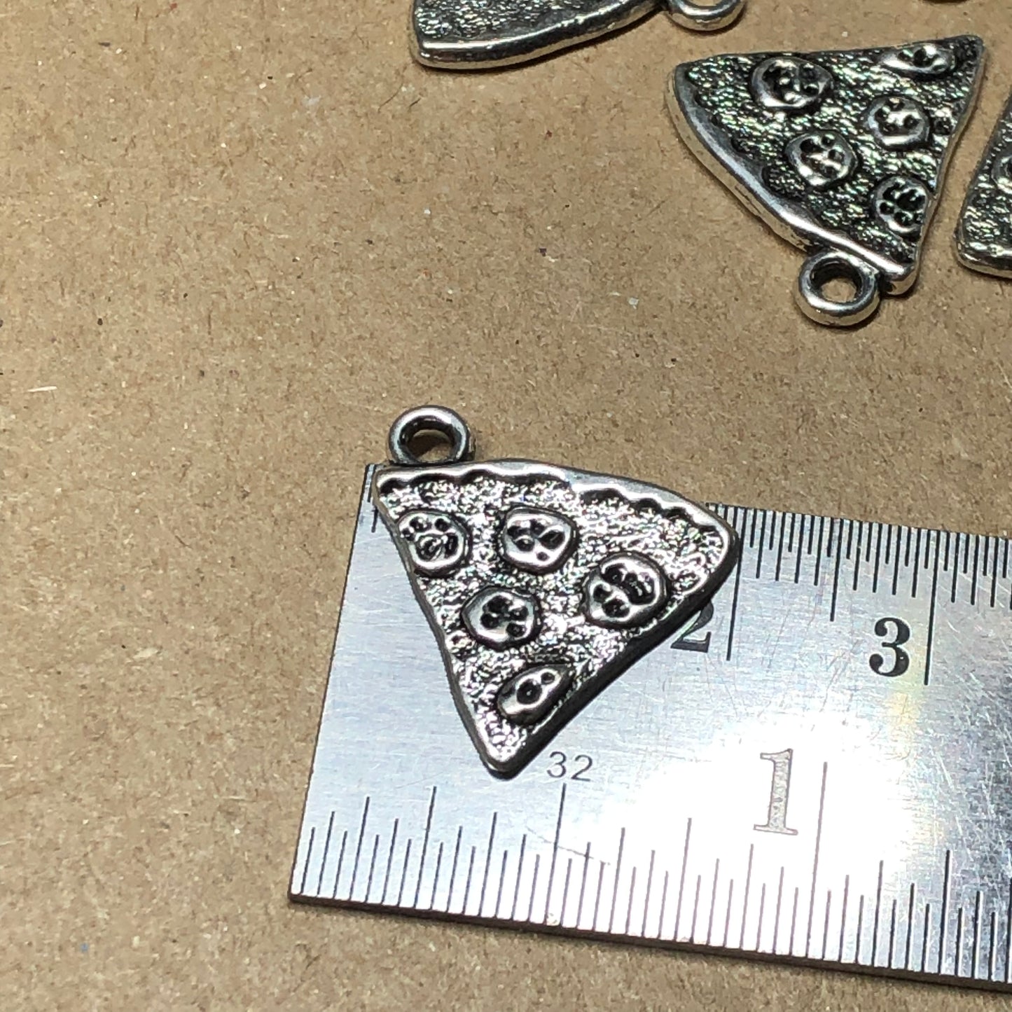 Twelve pizza slice charms