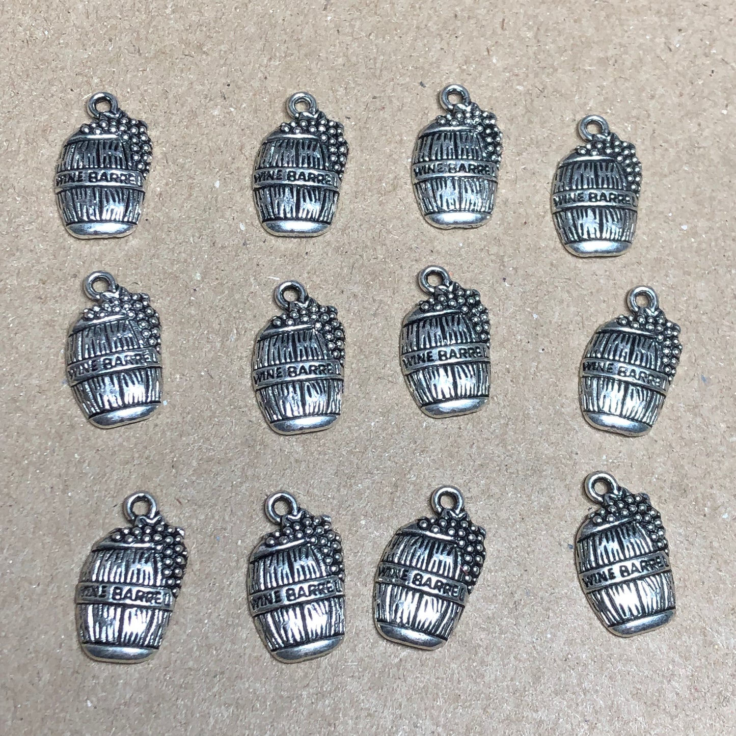 Twelve wine barrel charms