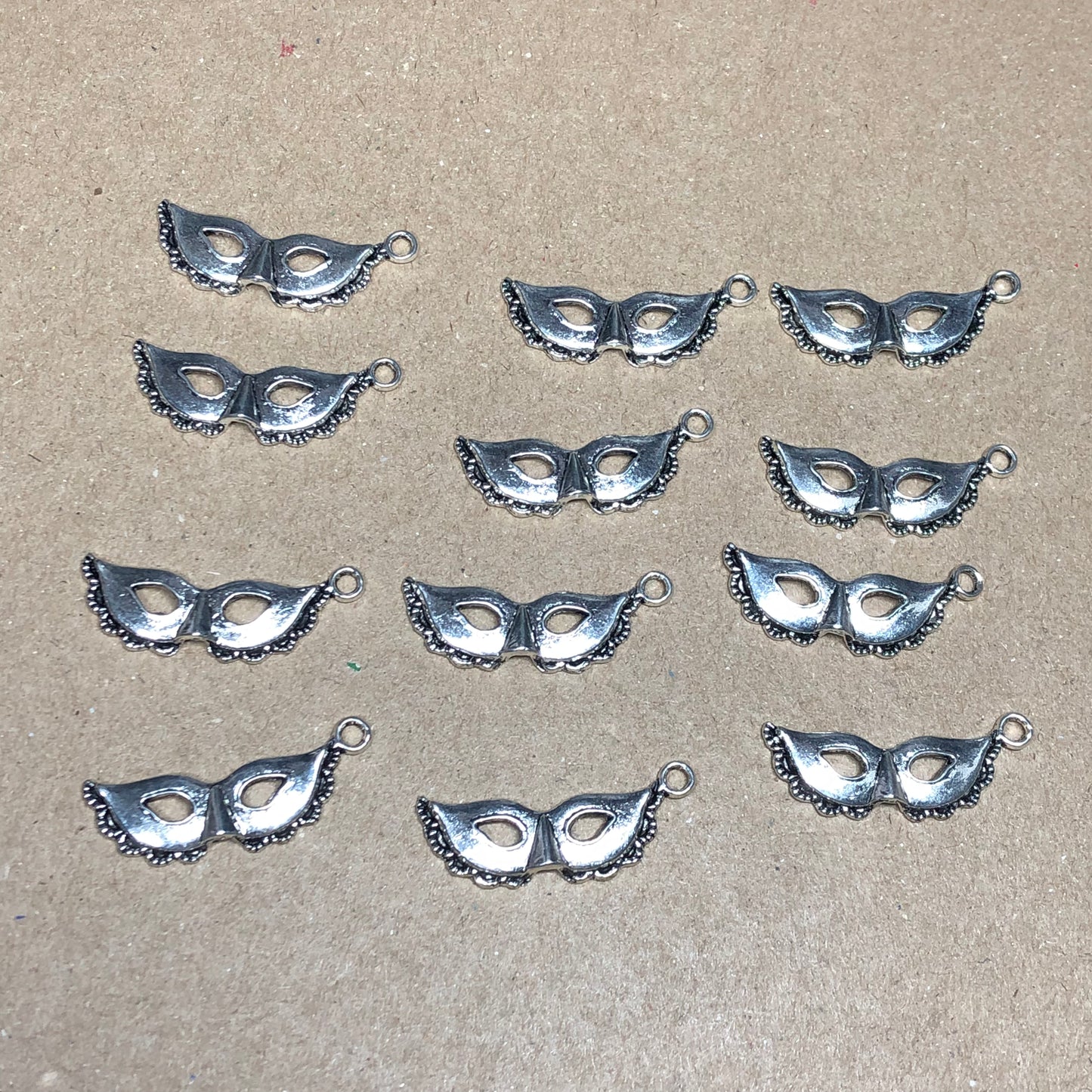 Twelve masquerade mask charms