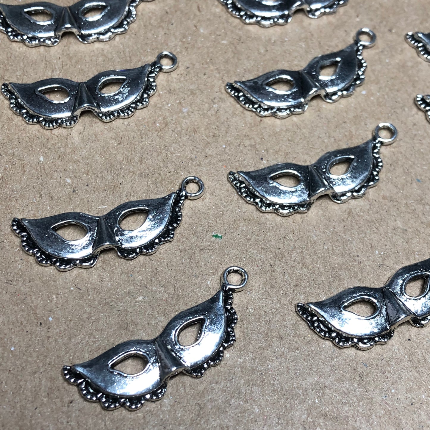 Twelve masquerade mask charms