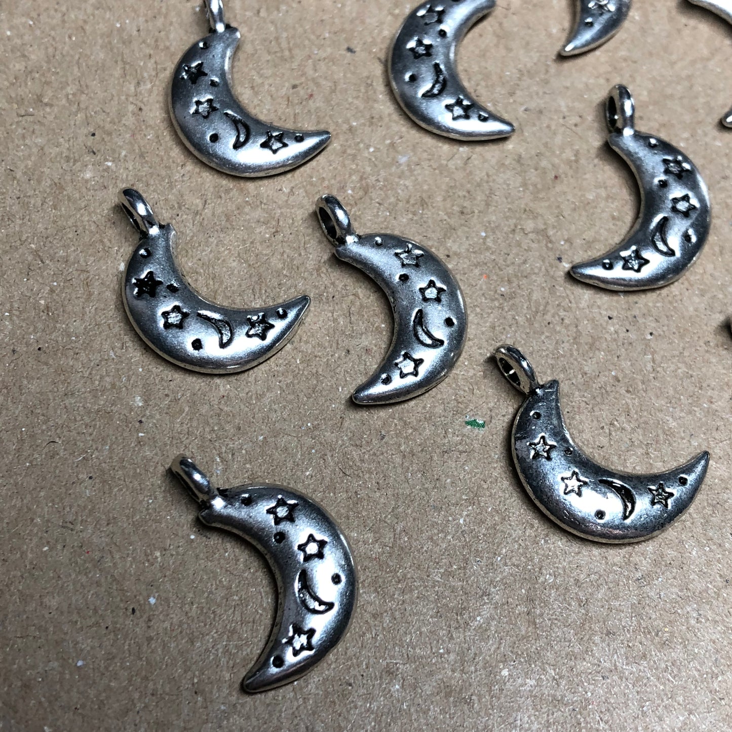 Twelve crescent moon charms