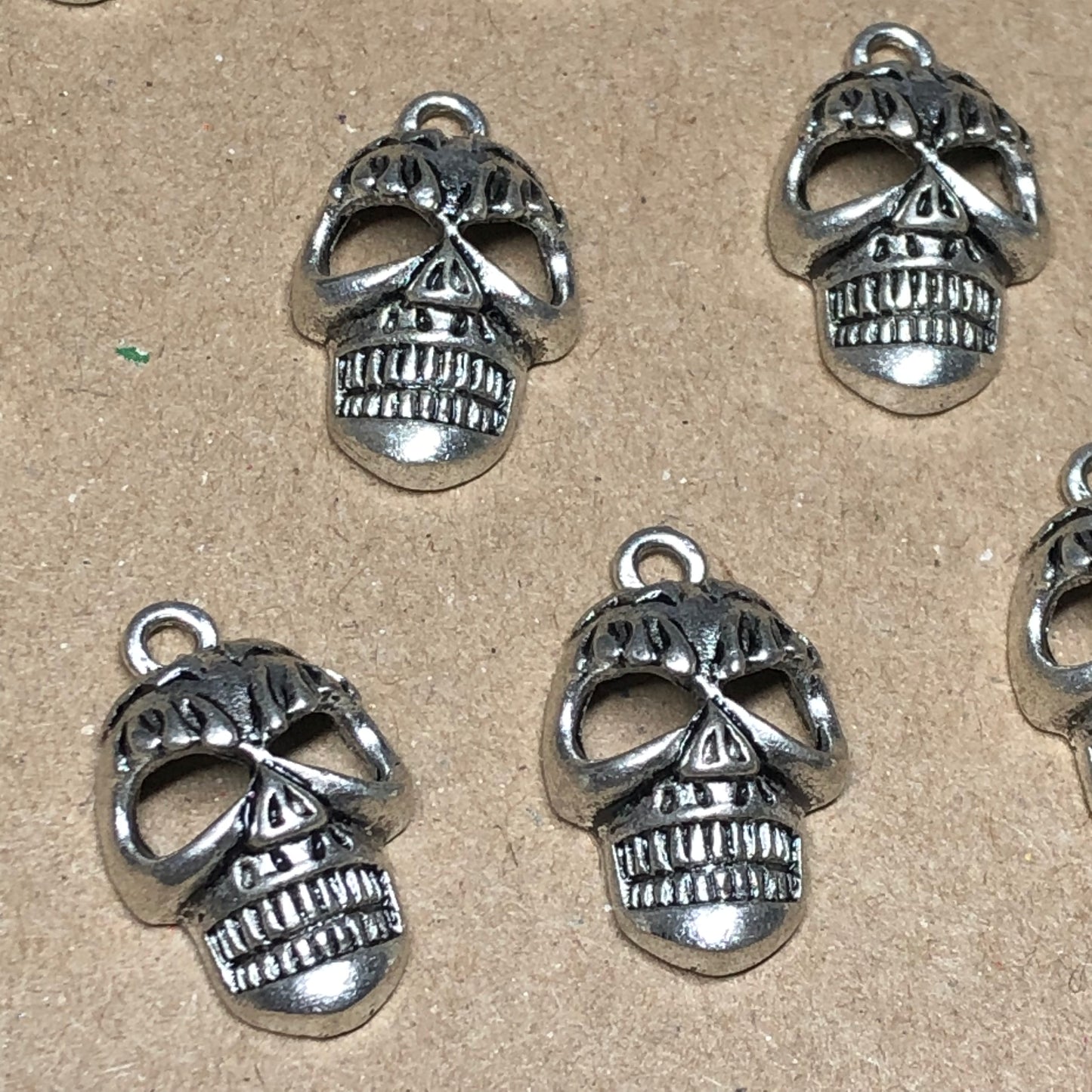 Ten creepy skull charms