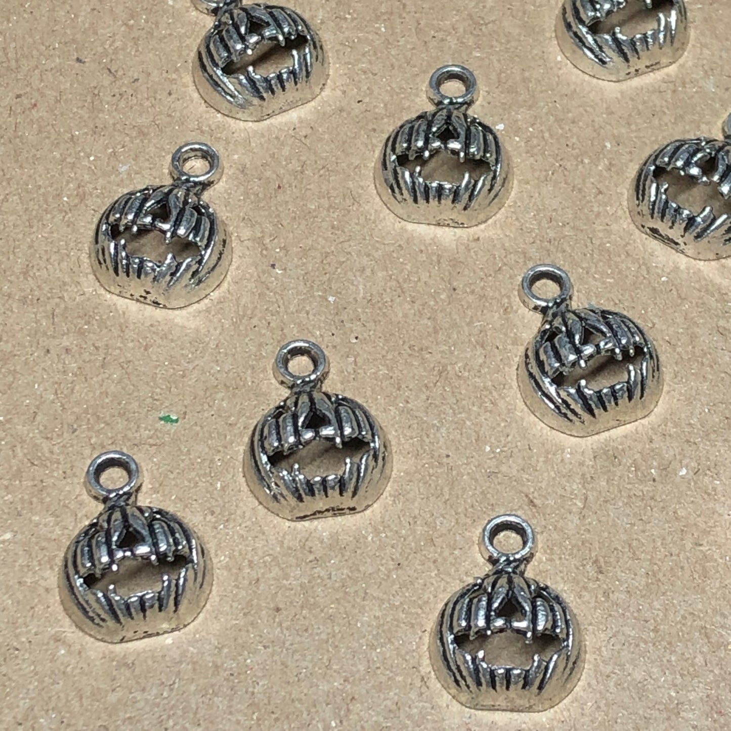 Twelve small pumpkin charms