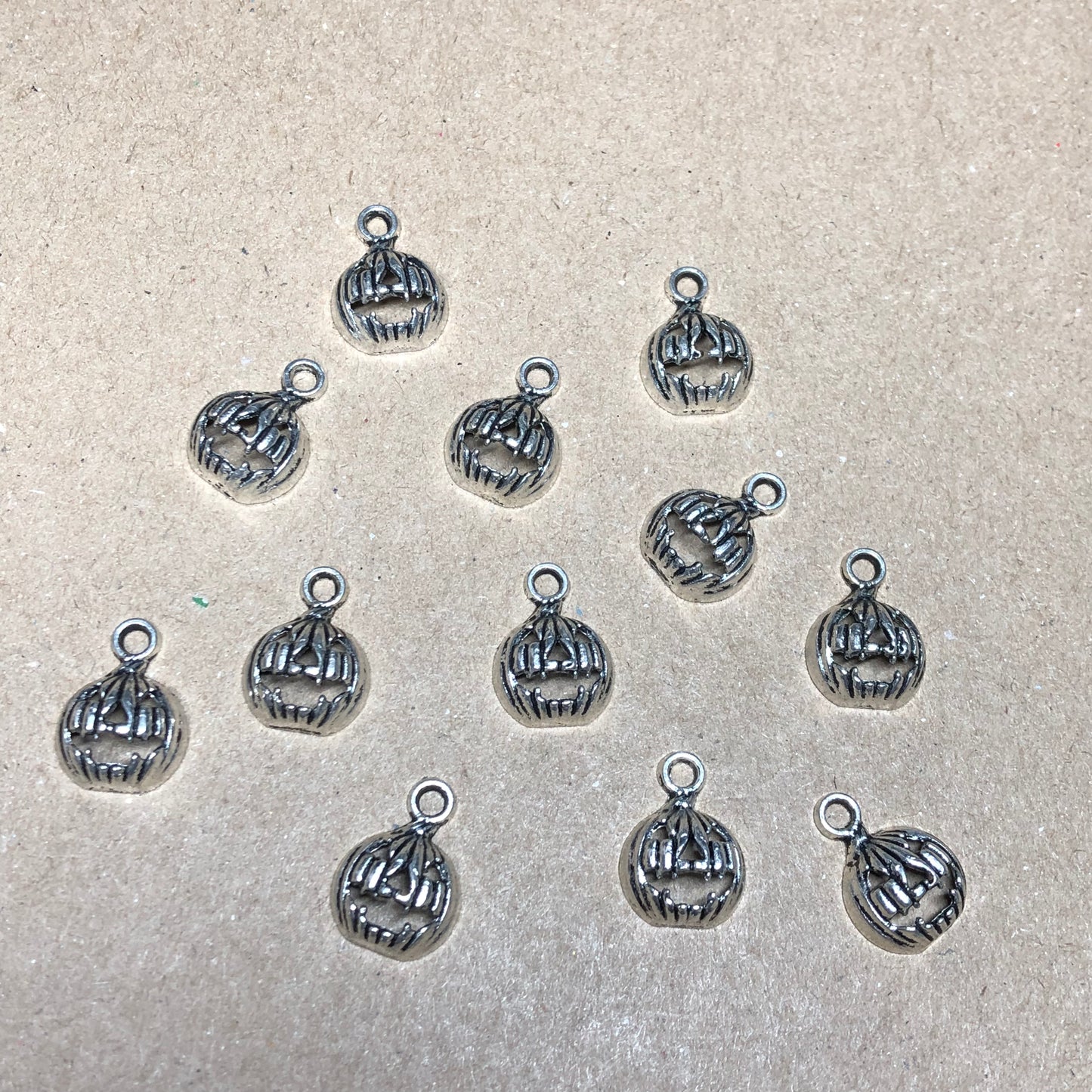 Twelve small pumpkin charms